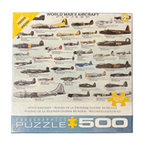 A 500-piece jigsaw puzzle box titled 'World War II Aircraft' by Eurographics, featuring numerous illustrated military planes on the front, photographed on a dark textured surface.