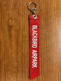 REMOVE BEFORE FLIGHT BBAP Ribbon Keychain